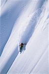 Snowboarder on mountain snowboarding