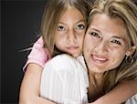 Portrait of a daughter hugging her mother