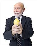 Portrait of a businessman holding a lemon