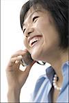 Profile of a mid adult woman talking on a cell phone