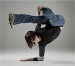 Close-up of a young woman break dancing