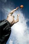 Basketball player shooting ball