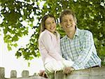 Portrait of a man and his daughter smiling