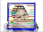 Close-up of a boy leaning in front of an abacus