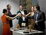 Group of people toasting drinks