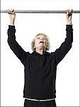 Older woman doing pull up exercises