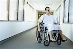 Patient sitting on a wheelchair in a hospital