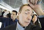 Close-up of a mature man traveling in a passenger train