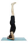 Profile of a man doing a headstand