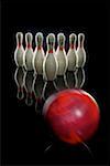 Bowling pins and bowling ball in motion