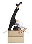 Female contortionist businesswoman inside cardboard box