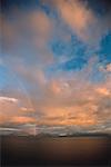 A rainbow in a cloudy sky