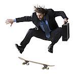 Businessman on skateboard jumping