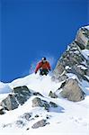 Ski jumper on mountain in air