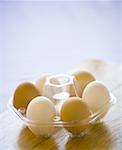 A variety of eggs in a container