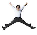 Portrait of a businessman jumping in midair