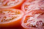 Close-up of four slices of tomato