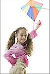 Portrait of a girl flying a kite