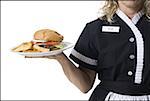 Waitress holding hamburger platter