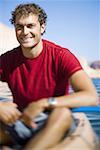 Portrait of a young man sitting in a kayak