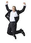 Portrait of a businessman smiling and jumping in mid-air