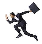 Businessman running with briefcase