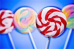Close-up of four lollipops