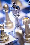 Close-up of chess pieces on a chessboard