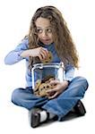 Close-up of a girl holding a jar of cookies
