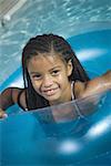 Portrait of a girl inside of an inner tube