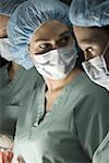 Close-up of three female surgeons operating