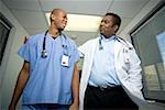 Low angle view of two male doctors walking in a corridor