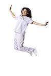 Portrait of a female nurse jumping