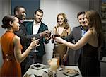 Group of people toasting at a party