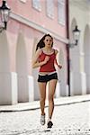 Low angle view of a young woman jogging