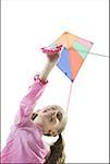 Close-up of a girl flying a kite