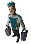 Bellboy with luggage smiling