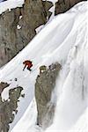 Downhill skier skiing on mountain