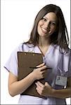 Portrait of a female nurse holding a clipboard