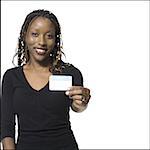 Woman holding name tag smiling