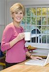 Portrait of a mature woman holding a coffee cup