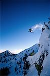 Downhill ski jumper in air