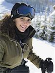 Woman with ski goggles outdoors in winter