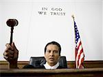 Portrait of a female judge holding a gavel