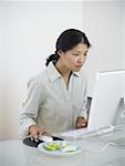 Mid adult woman sitting in front of a computer