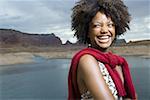 Close-up of a young woman standing on a lakeside