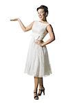 Woman in white dress gesturing