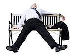 Businessman sleeping on a bench