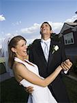 Close-up of a newlywed couple dancing