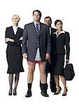 Group of four businesspeople with man in boxers